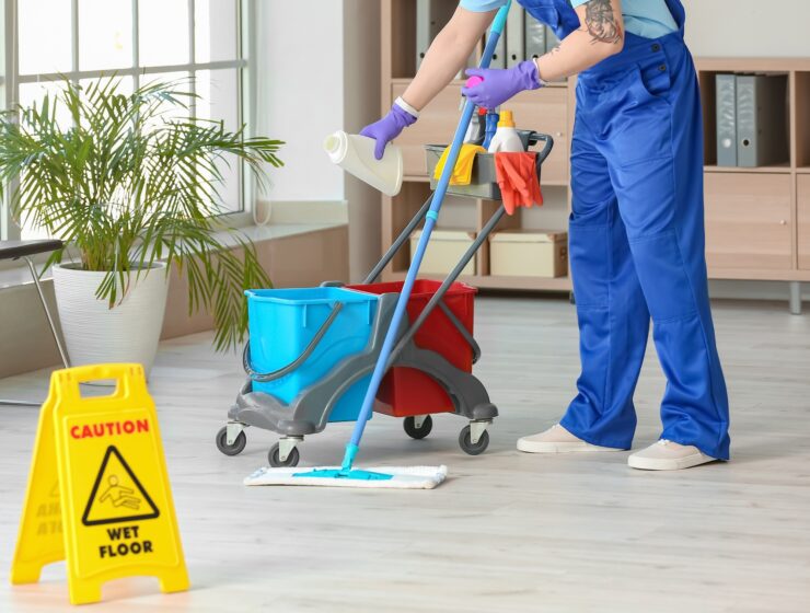 male-janitor-cleaning-in-office